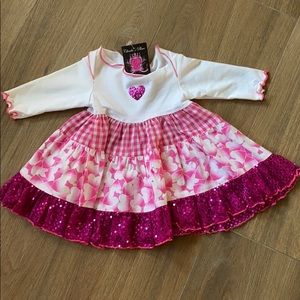 4 tier heart baby dress. Brand new. 12 months.